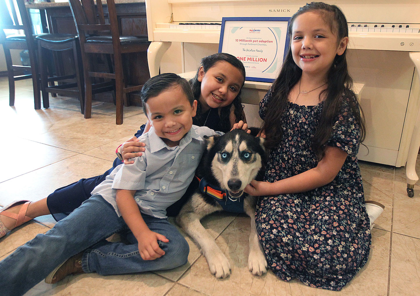 The De La Rosa children and their dog Balto